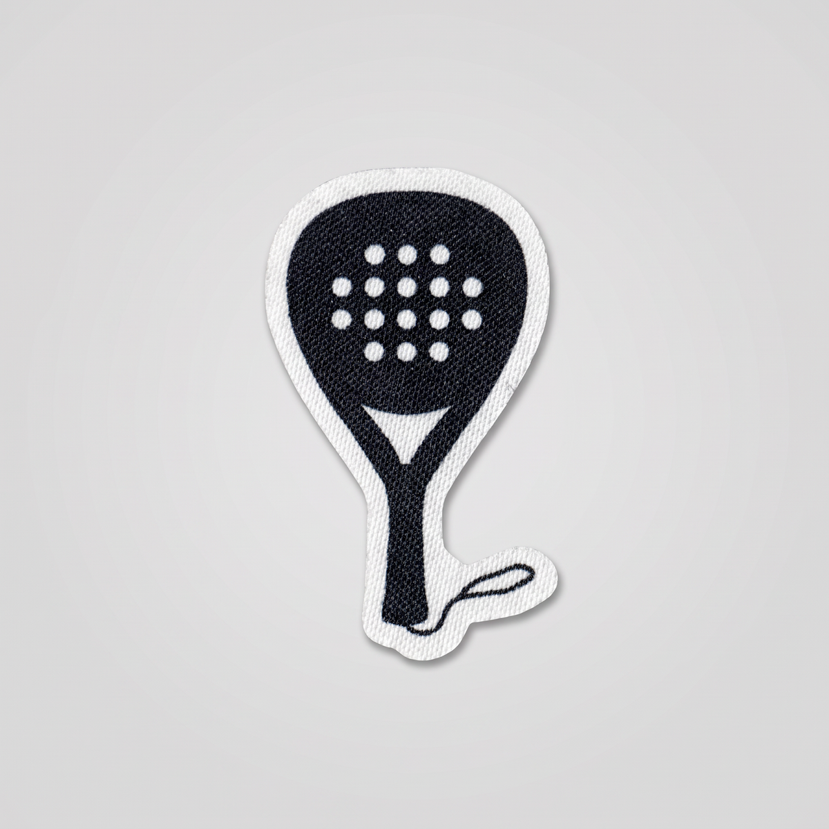 Black padel racket fabric patch with polka dots