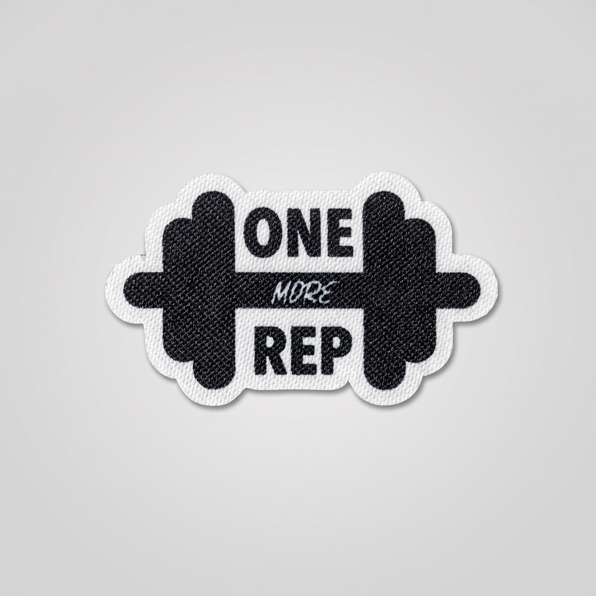 One More Rep fabric patch with dumbbell icon