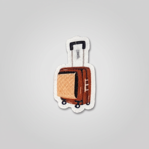 Brown rolling suitcase illustration fabric patch