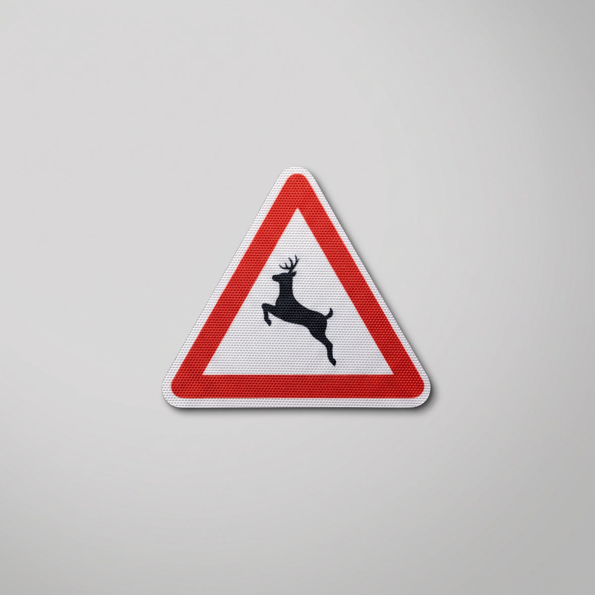 Red triangle road sign fabric patch with leaping deer