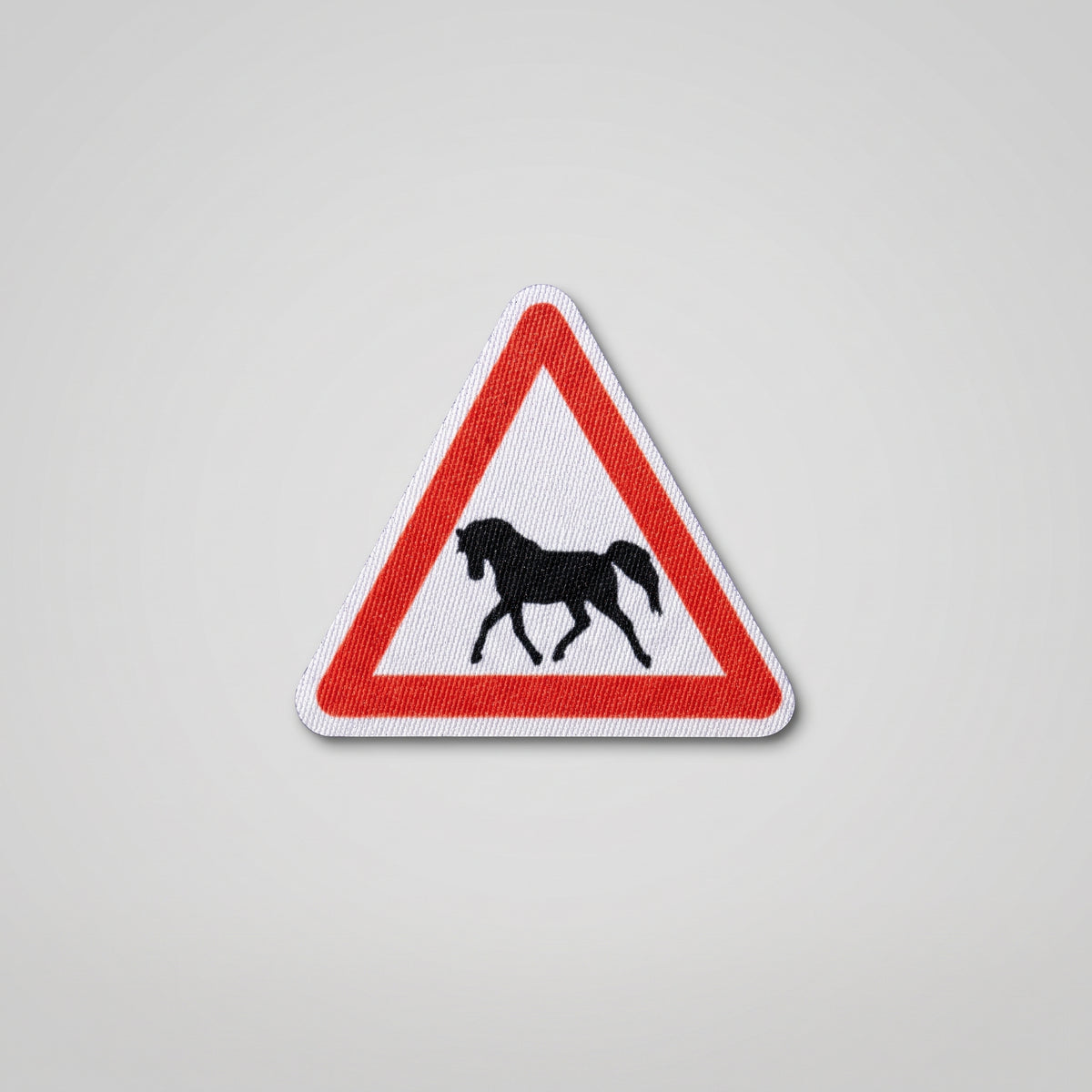 Red triangle road sign fabric patch with horse