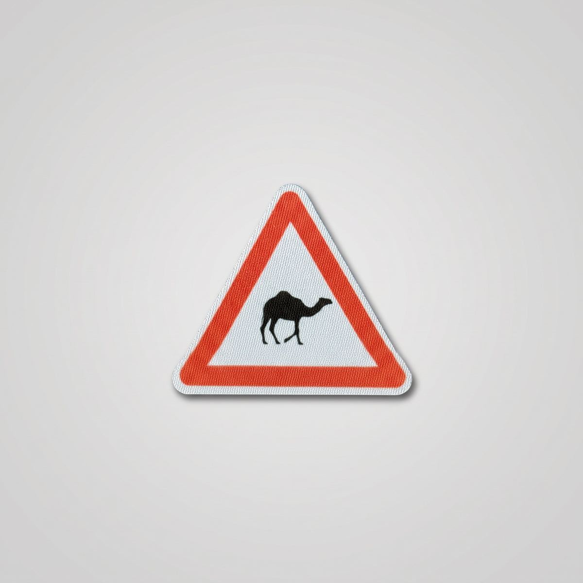 Red triangle road sign fabric patch with camel